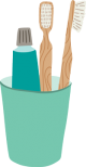 Toothpaste and bamboo toothbrushes in a cup.