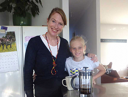 Sharon and her daughter in their kitchen with a plunger coffee